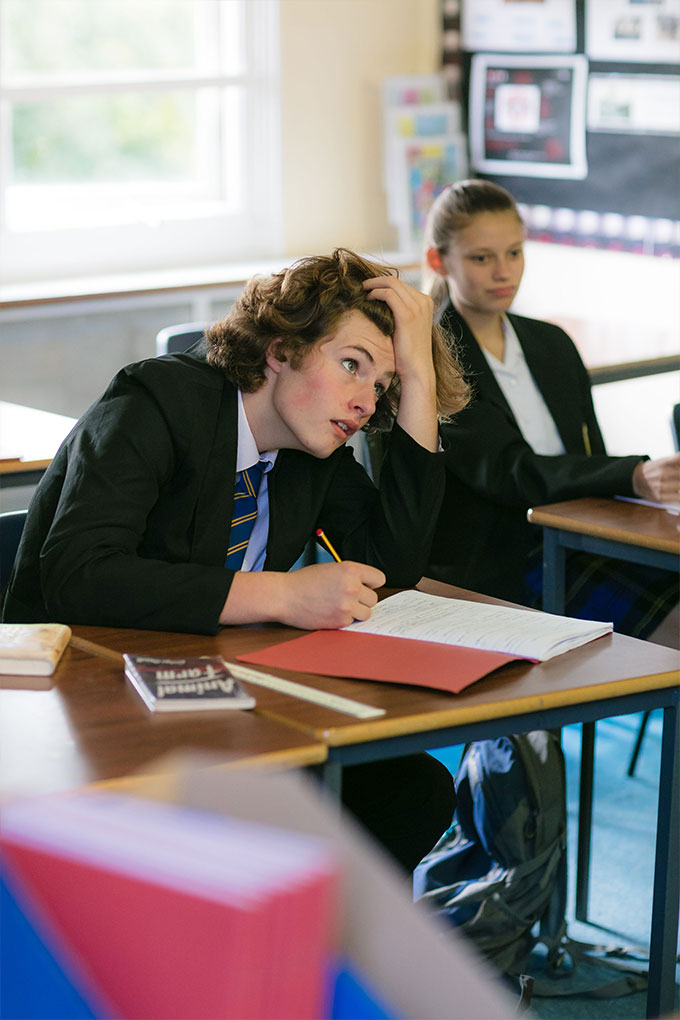 Moon Hall pupil studying during a Geography lesson